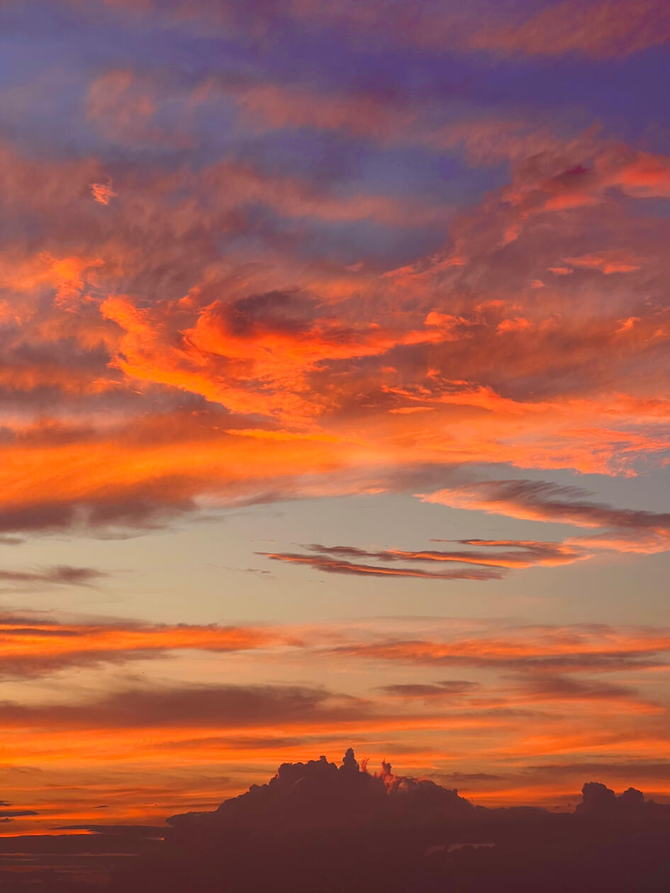 City in the Clouds, 2025. I see figures standing atop their cloud city. Enchanting colors required a thoughtful photo.